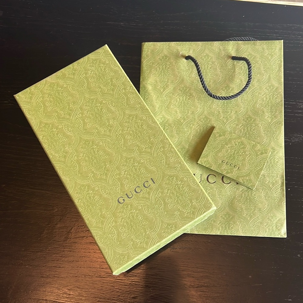 Gucci box, bag, and receipt holder.